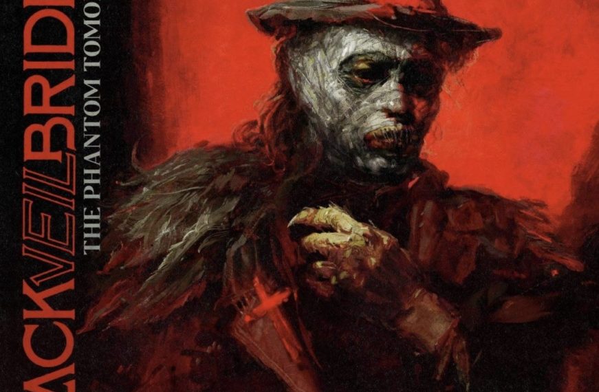 Das Albumcover "The Phantom Tomorrow" von Black Veil Brides ist ein Gemälde eines Mannes. Er hat einen Hut auf und trägt eine weiße Maske über seinem Gesicht - wie ein Phantom. Der Hintergrund ist rot.