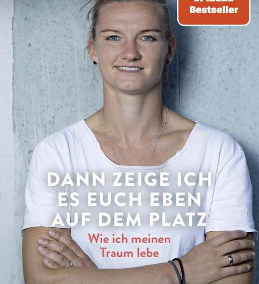 Das Buchcover "Dann zeige ich es euch eben auf dem Platz" zeigt die Fußballerin Alexandra Popp im Porträt mit verschränkten Armen.